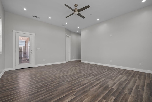 unfurnished living room with dark hardwood / wood-style floors and ceiling fan