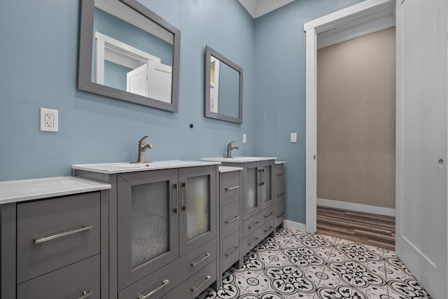 bathroom featuring vanity, tile patterned floors, and ornamental molding