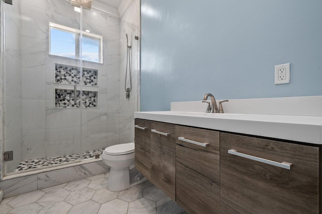 bathroom featuring vanity, toilet, and walk in shower