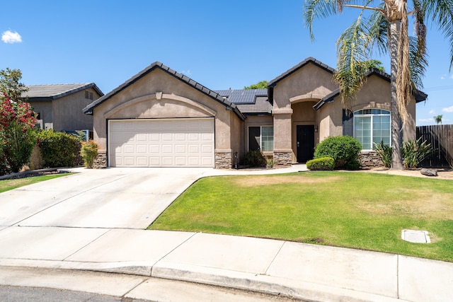 ranch-style home featuring stone siding, stucco siding, an attached garage, solar panels, and concrete driveway