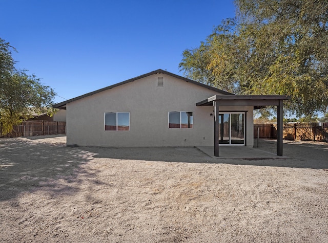 rear view of house featuring a patio