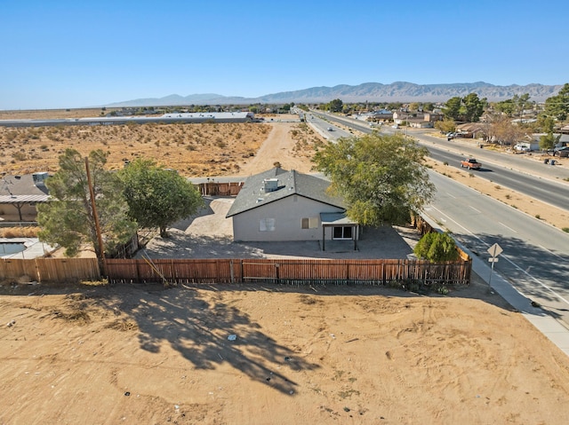 birds eye view of property with a mountain view