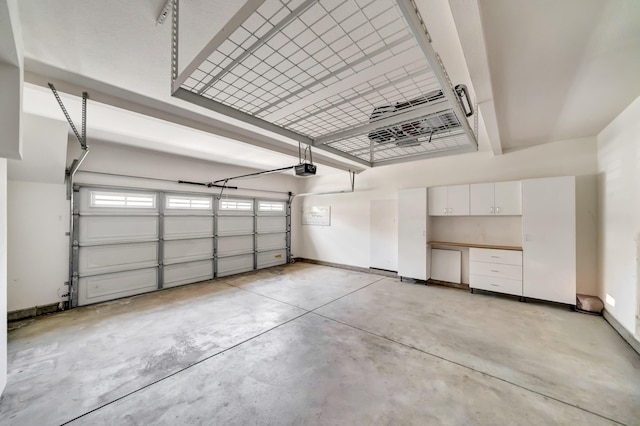 27735 Summer Grove Pl, Valencia, CA 91354 - garage featuring baseboards and a garage door opener