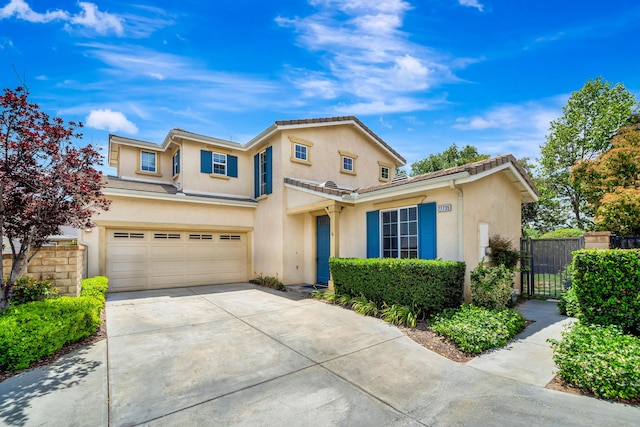 27735 Summer Grove Pl, Valencia, CA 91354 - traditional-style home featuring stucco siding, driveway, a garage, and a gate