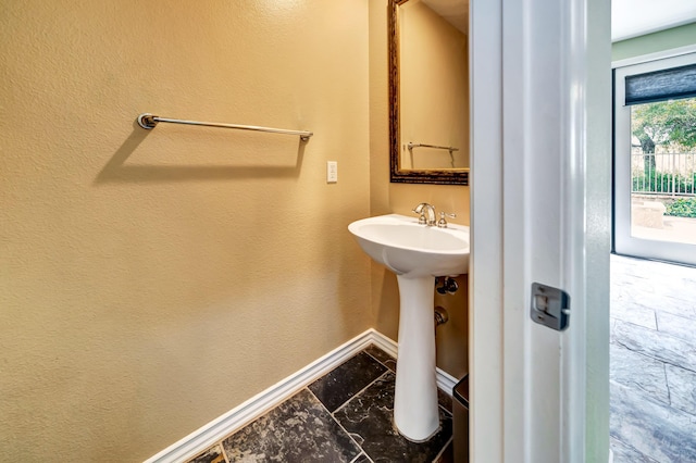 27735 Summer Grove Pl, Valencia, CA 91354 - bathroom with baseboards and a sink