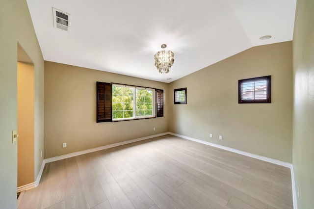 27735 Summer Grove Pl, Valencia, CA 91354 - unfurnished room featuring light wood finished floors, a chandelier, baseboards, and vaulted ceiling