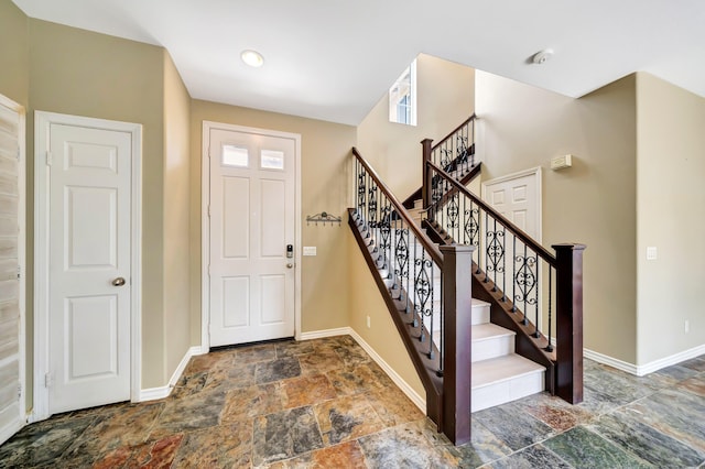 27735 Summer Grove Pl, Valencia, CA 91354 - foyer featuring stone tile floors, baseboards, and stairs