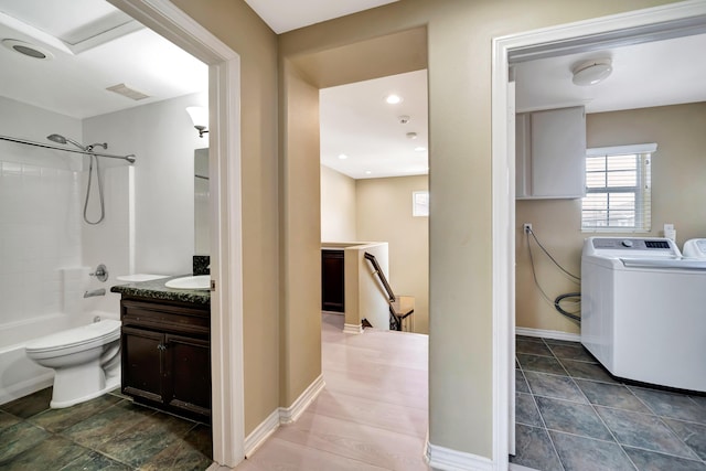 27735 Summer Grove Pl, Valencia, CA 91354 - full bath with washer / dryer, vanity, shower / bathtub combination, toilet, and baseboards
