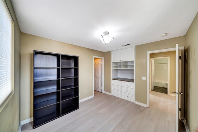 27735 Summer Grove Pl, Valencia, CA 91354 - unfurnished bedroom featuring light wood-style flooring and baseboards