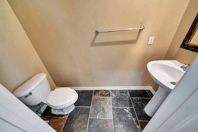 27735 Summer Grove Pl, Valencia, CA 91354 - bathroom with baseboards, toilet, and a sink