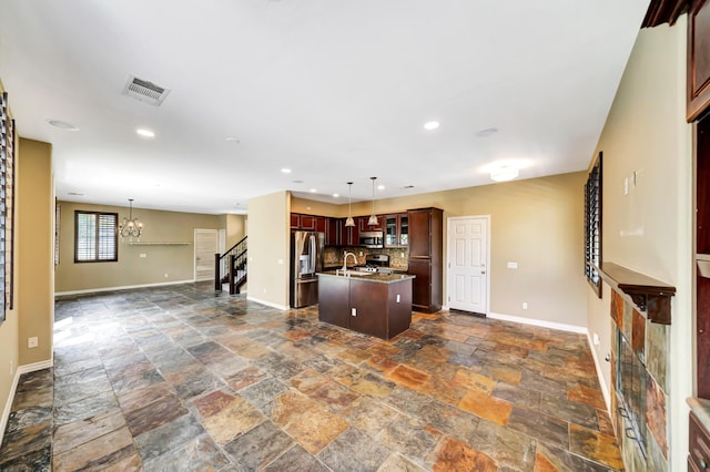 27735 Summer Grove Pl, Valencia, CA 91354 - kitchen with appliances with stainless steel finishes, stone tile floors, baseboards, and recessed lighting