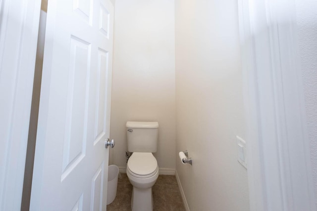 bathroom with tile patterned floors and toilet