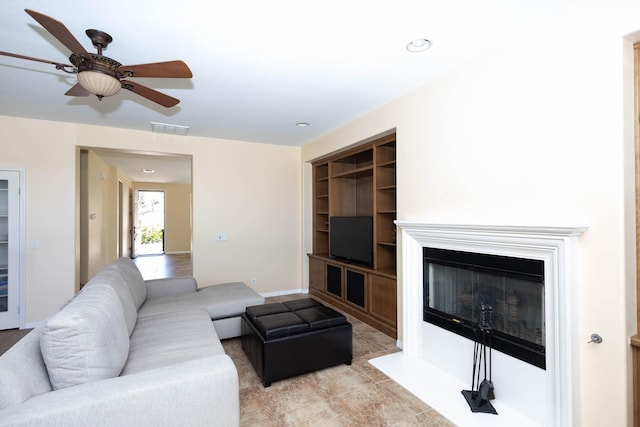 living room featuring ceiling fan