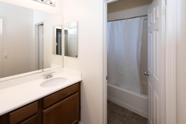 bathroom with tile patterned flooring, vanity, and shower / tub combo