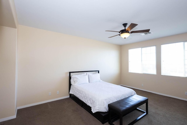 bedroom featuring dark carpet and ceiling fan