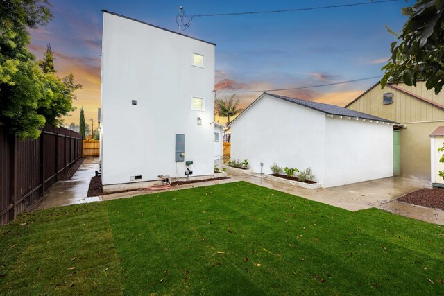 11946 Aneta St, Culver City, CA 90230 - rear view of house with fence, a lawn, and stucco siding