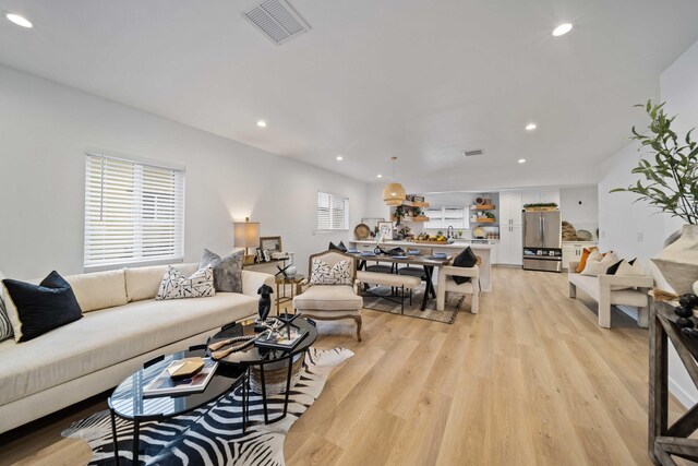 11946 Aneta St, Culver City, CA 90230 - living area with light wood-style floors, recessed lighting, and visible vents