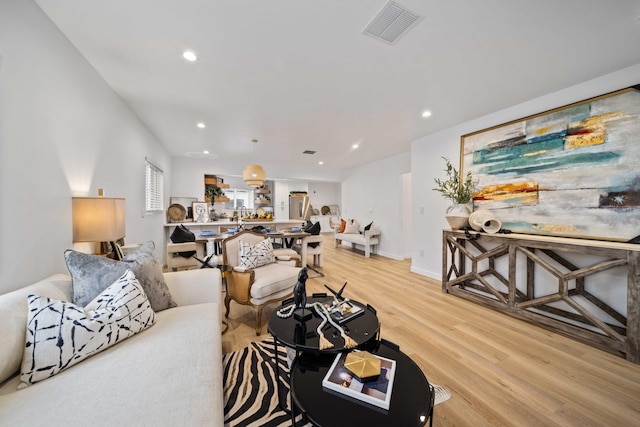 11946 Aneta St, Culver City, CA 90230 - living area with visible vents, light wood-style flooring, recessed lighting, and baseboards