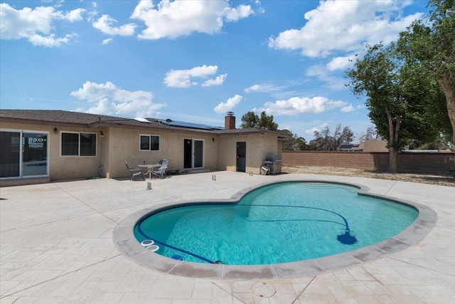 44850 E 43rd St, Lancaster, CA 93535 - view of swimming pool featuring a patio, a fenced backyard, and a grill