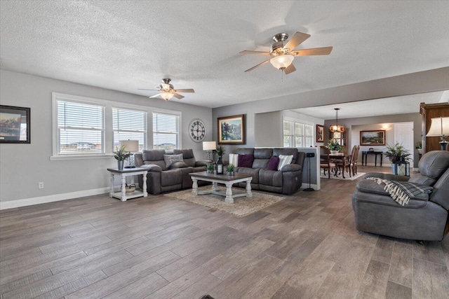 44850 E 43rd St, Lancaster, CA 93535 - living room with wood finished floors, a ceiling fan, baseboards, and a textured ceiling