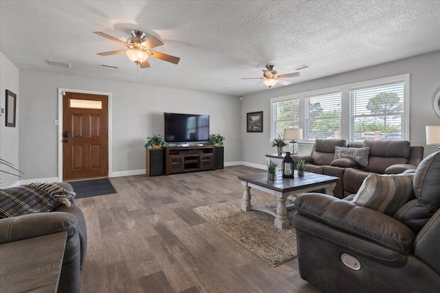 44850 E 43rd St, Lancaster, CA 93535 - living room with ceiling fan, wood finished floors, baseboards, and a textured ceiling