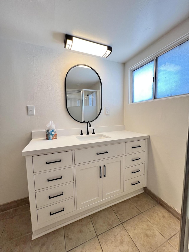 bathroom featuring tile patterned floors and vanity