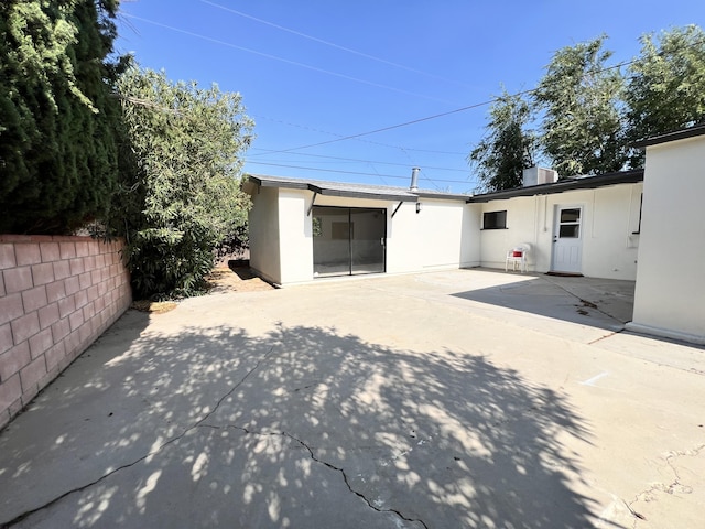 rear view of house featuring a patio