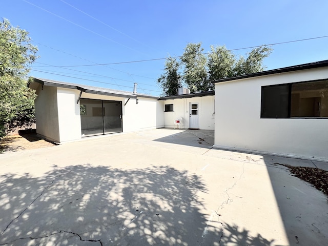 back of property featuring a patio area