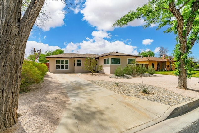 44251 Date Ave, Lancaster, CA 93534 - ranch-style house featuring concrete driveway and stucco siding