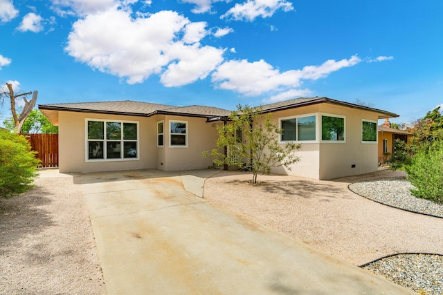 44251 Date Ave, Lancaster, CA 93534 - rear view of property featuring fence, a patio area, and stucco siding