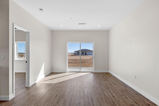 empty room featuring hardwood / wood-style floors