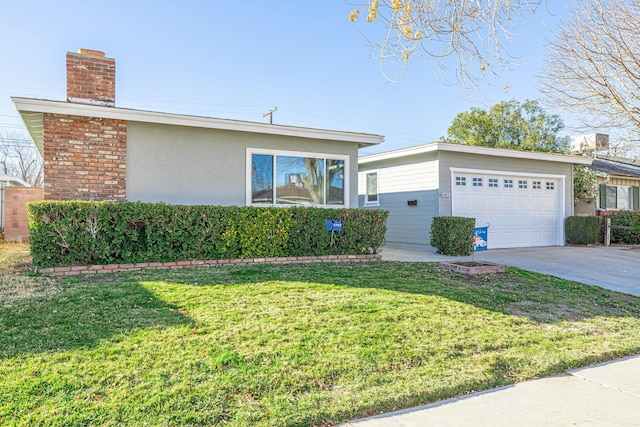 ranch-style home featuring a garage and a front lawn