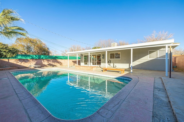 view of pool featuring a patio