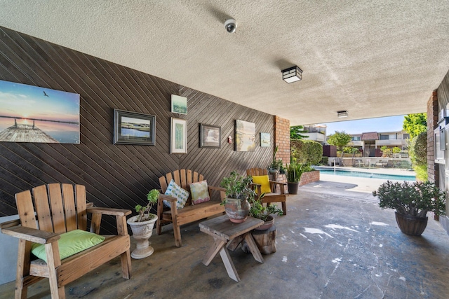 view of patio featuring a fenced in pool