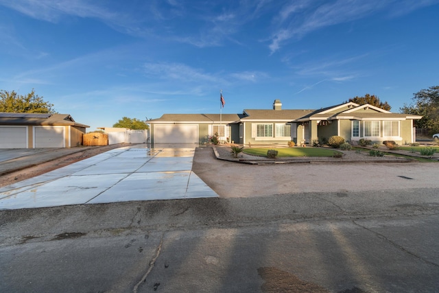 ranch-style home featuring a garage