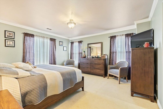 bedroom featuring visible vents, light colored carpet, and ornamental molding