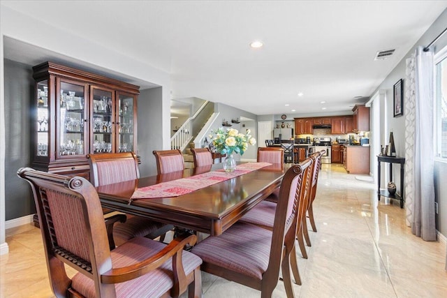 dining area with visible vents, marble finish floor, recessed lighting, baseboards, and stairs