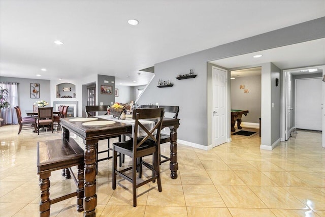 dining area with light tile patterned floors, recessed lighting, and baseboards