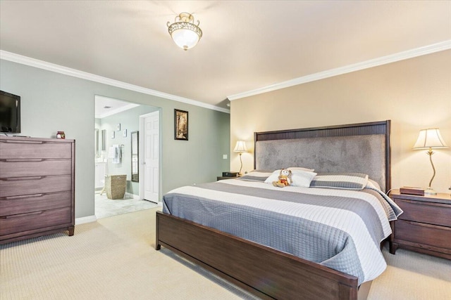 carpeted bedroom with baseboards, ensuite bath, and crown molding