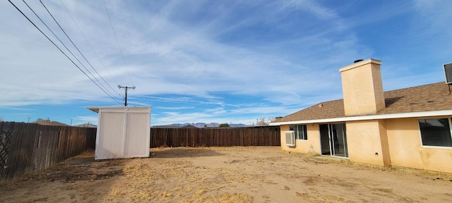 view of yard with a storage unit