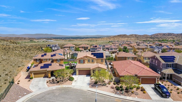 birds eye view of property with a mountain view and a residential view