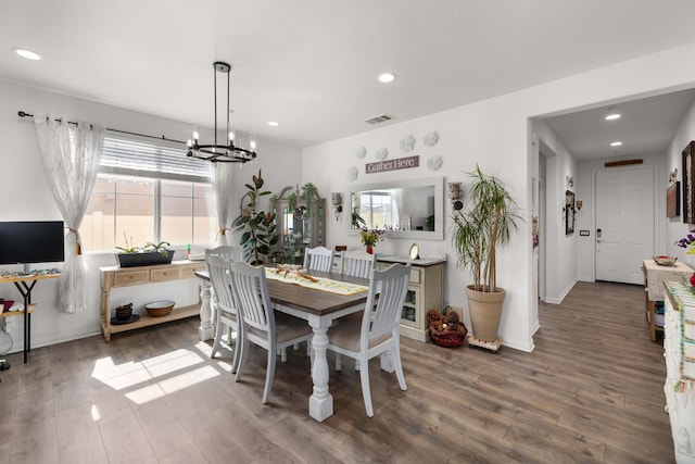 dining area with recessed lighting, a notable chandelier, visible vents, and wood finished floors