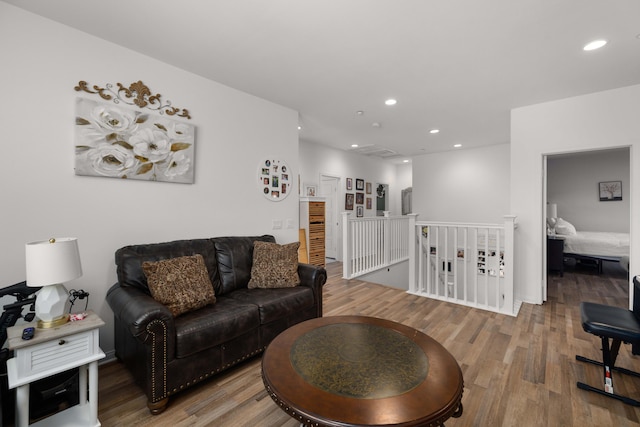 living area featuring recessed lighting and wood finished floors