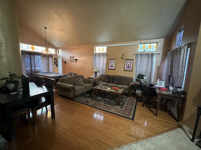 37847 Tacksteam St, Palmdale, CA 93552 - living area featuring vaulted ceiling, hardwood / wood-style floors, a chandelier, and a desk