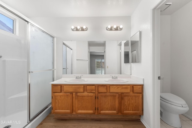 44242 Brandon Thomas Way, Lancaster, CA 93536 - full bath featuring double vanity, a stall shower, plenty of natural light, and wood finished floors