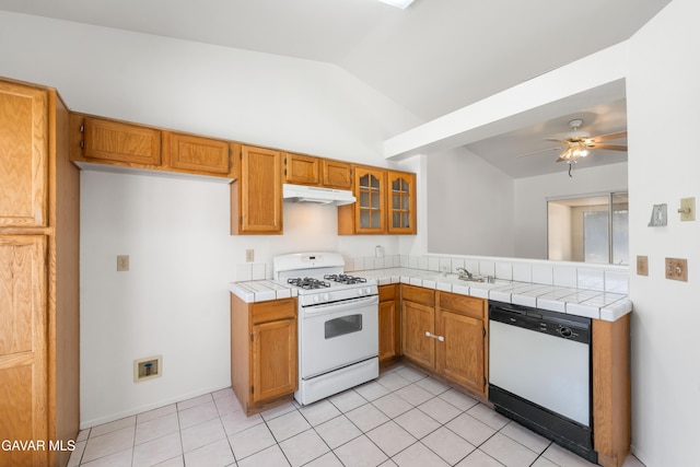 44242 Brandon Thomas Way, Lancaster, CA 93536 - kitchen featuring white appliances, under cabinet range hood, lofted ceiling, brown cabinets, and a ceiling fan