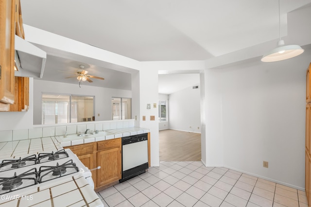 44242 Brandon Thomas Way, Lancaster, CA 93536 - kitchen featuring white appliances, tile countertops, ceiling fan, light tile patterned flooring, and open floor plan