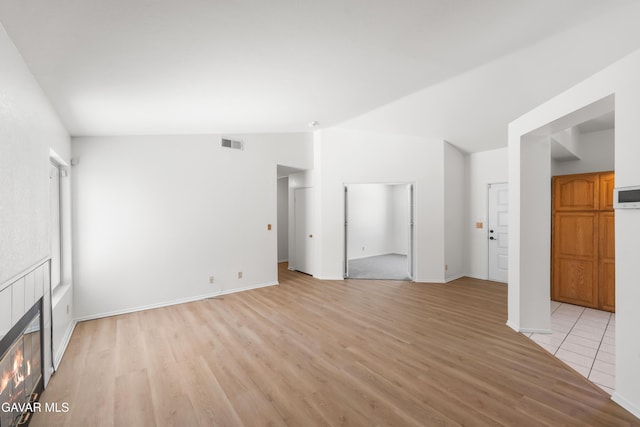 44242 Brandon Thomas Way, Lancaster, CA 93536 - unfurnished living room featuring light wood finished floors and a tile fireplace