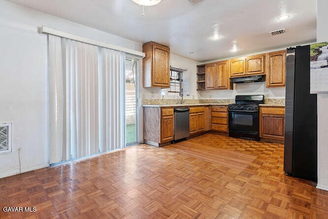 43667 Park Ave, Lancaster, CA 93534 - kitchen featuring stainless steel appliances, exhaust hood, open shelves, and brown cabinetry