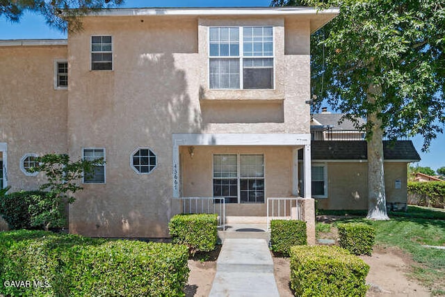 43667 Park Ave, Lancaster, CA 93534 - view of front of house featuring stucco siding and a porch